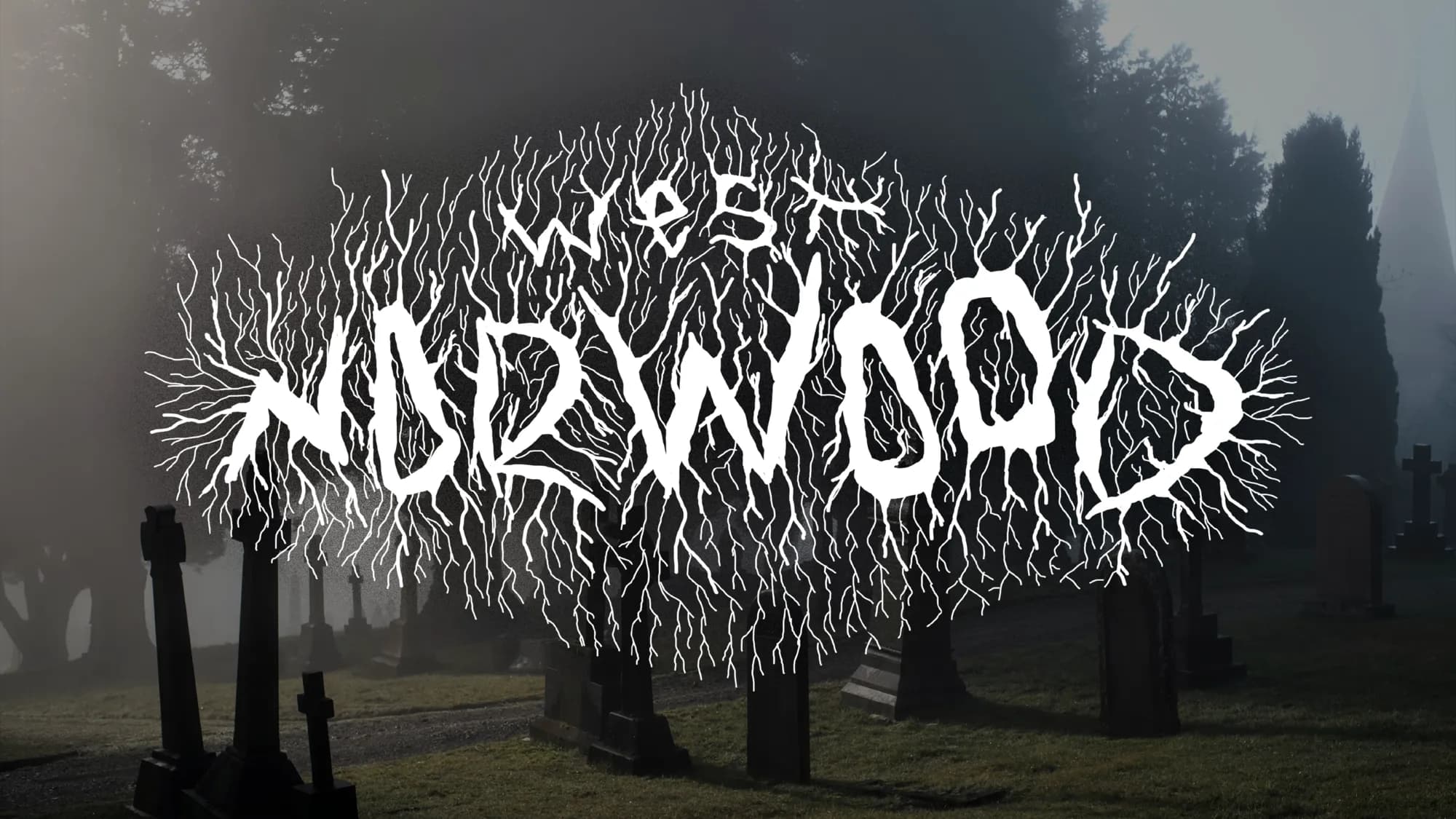 Branching root-like lettering reading West Norwood, white on a photograph of a foggy cemetery